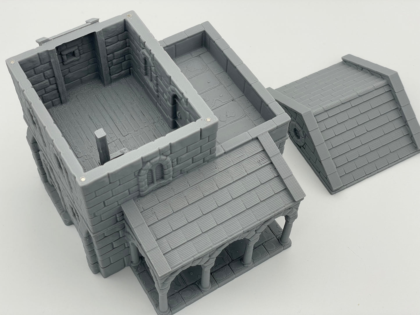 Produktová fotografie Tabletop 28mm Tisk pokračuje dál (TPGEO) 0: Středověký obytný dům A - Kamenná budova z lidského království Gonthan - Choditelný terén