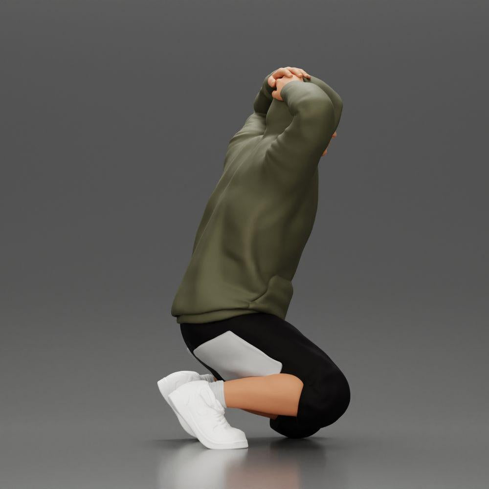 Diorama Modellismo Foto prodotto 1: Uomo inginocchiato con felpa con cappuccio, mani dietro la testa - Miniatura Diorama (Ref Nr. A70)