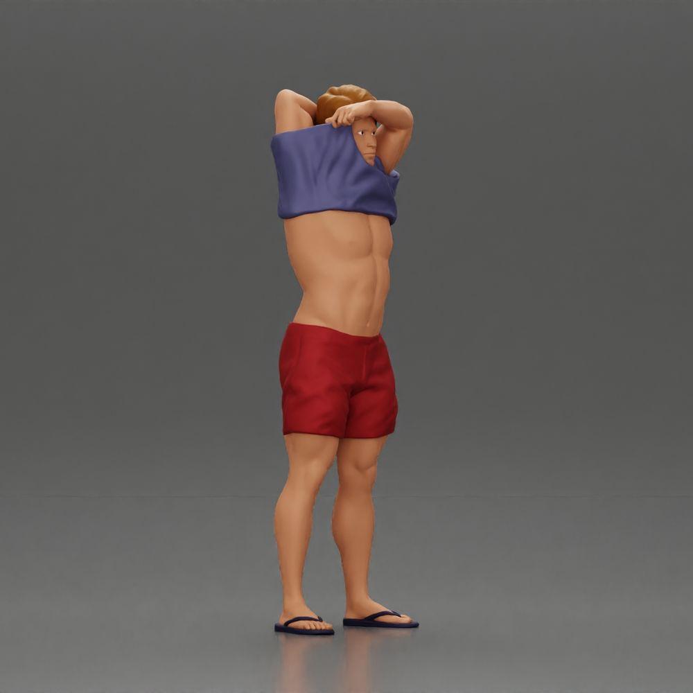 Imagem do produto de modelismo diorama 1: Miniatura em pé: homem musculoso em calções puxando a t-shirt sobre a cabeça (Ref Nr. A90)