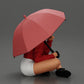 Imagem do produto de modelismo de diorama 1: Miniatura de diorama: Mulher sentada com casaco e calções com guarda-chuva aberto (Ref Nr. A85)