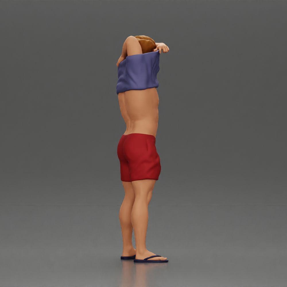 Imagem do produto de modelismo de diorama 2: Miniatura em pé: homem musculoso em calções puxando a t-shirt sobre a cabeça (Ref Nr. A90)