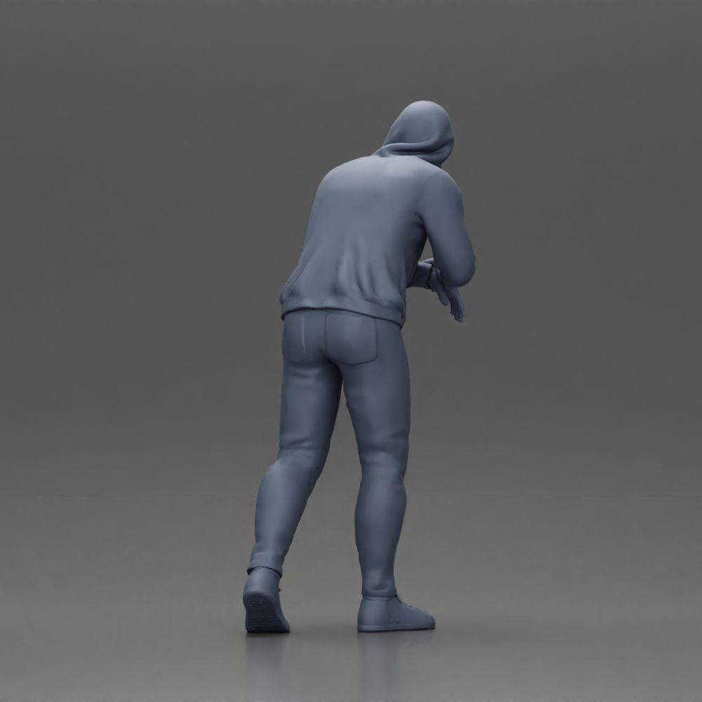 Imagem do produto de modelismo de diorama 9: Figura de diorama: Homem com capuz, mãos no carro, ligeiramente inclinado para a frente (Ref Nr. A115)