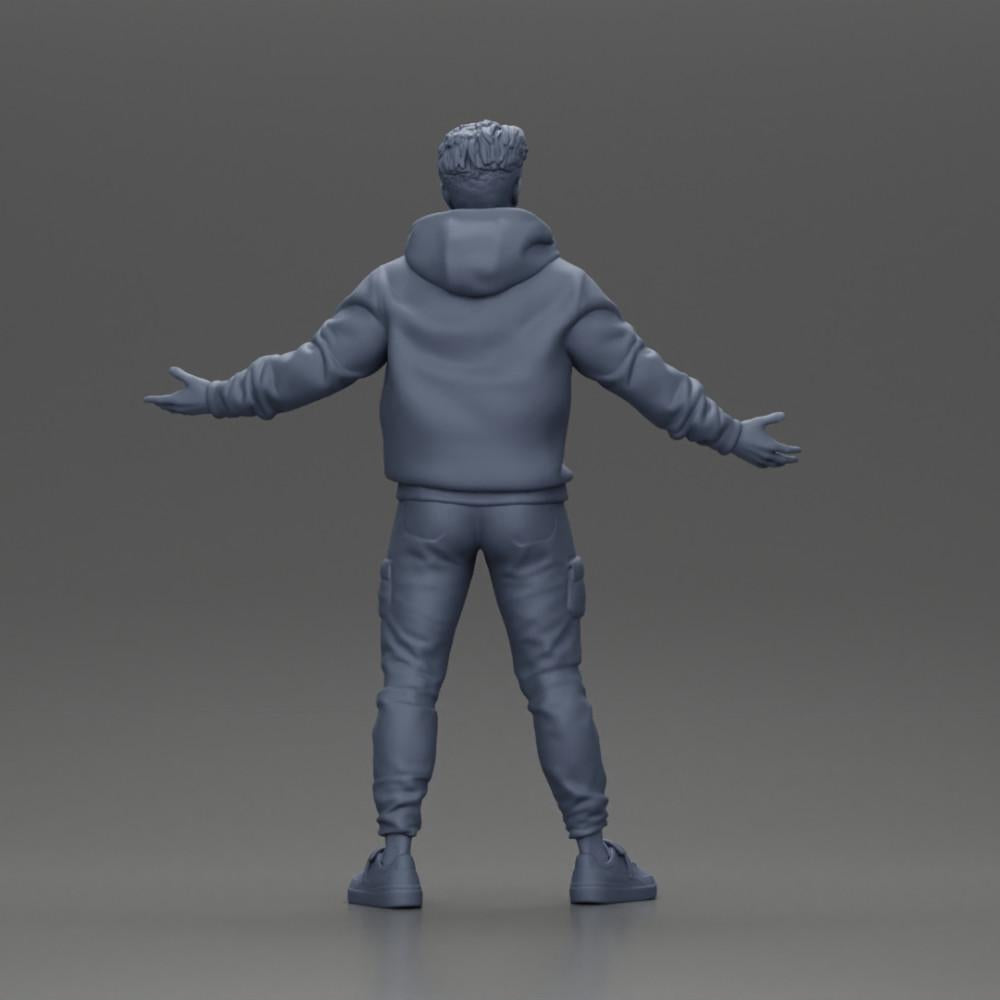 Diorama modelářství produktová fotografie 9: Miniaturní figura asijského muže v mikině s kapucí, ruce vztyčené do stran (Ref Nr. A60)